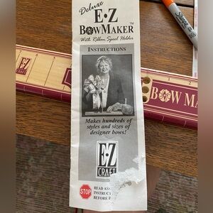 The Deluxe E-Z Bow Maker is a vintage crafting tool that was released 1995.  GUC